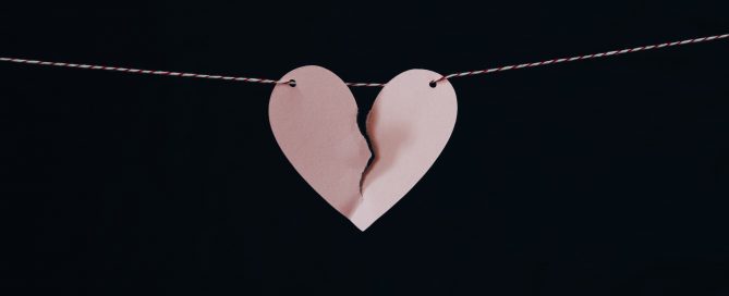broken heart hanging on wire