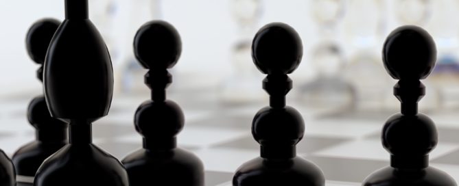 a close up of a chess board with pieces on it