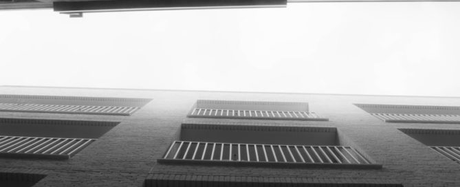 a black and white photo of a brick building
