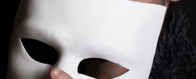 man with white face mask